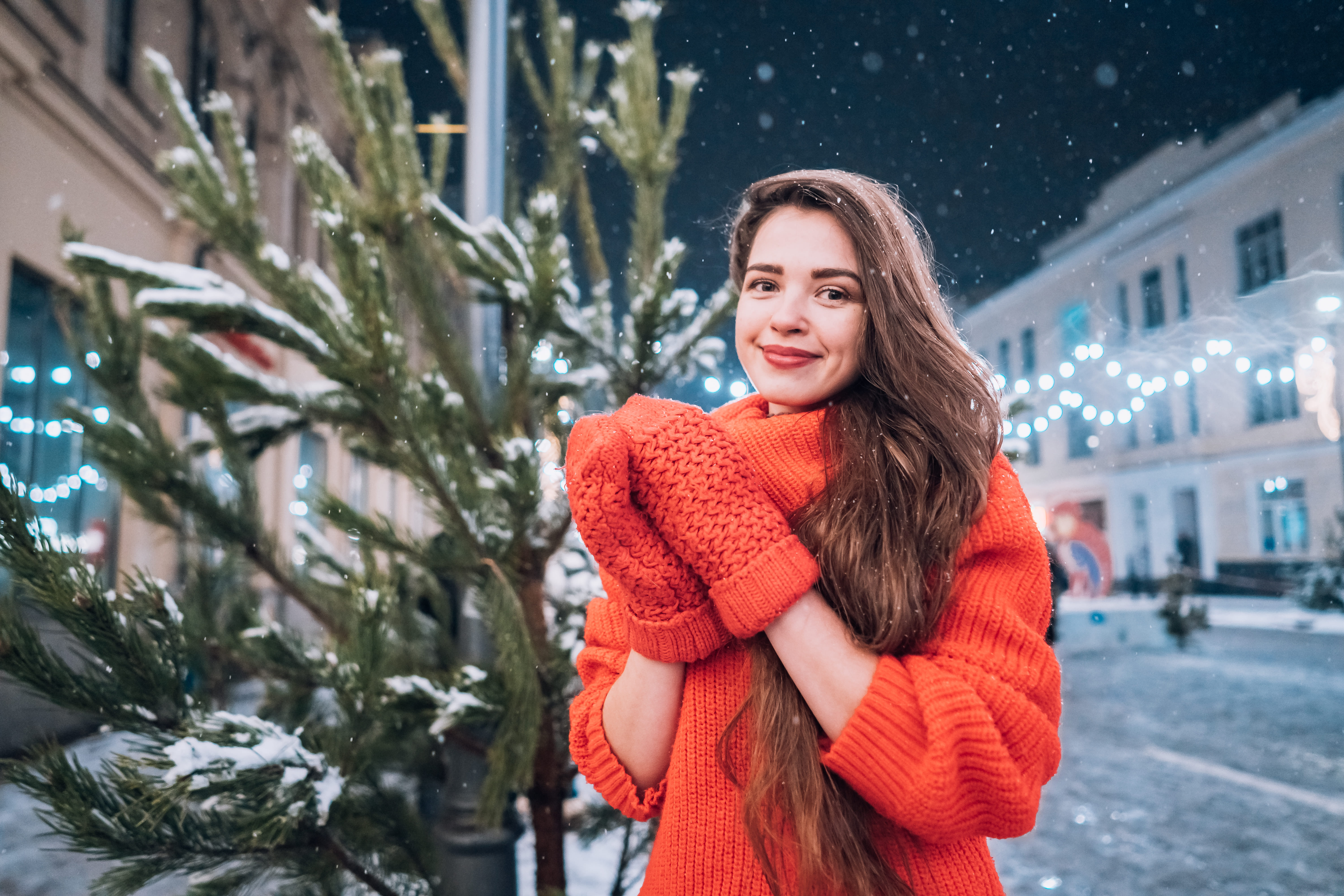 young-woman-posing-near-christmas-tree-street (1).jpg